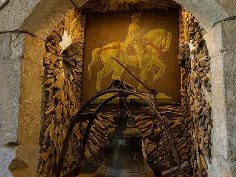 Alcove in the chapel with the original bell